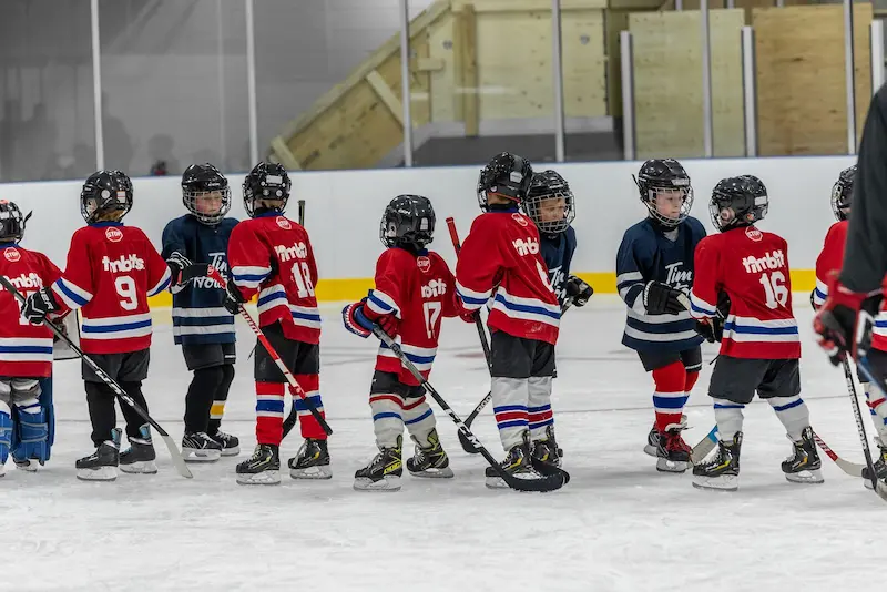 timbit hockey players shaking hands in a line